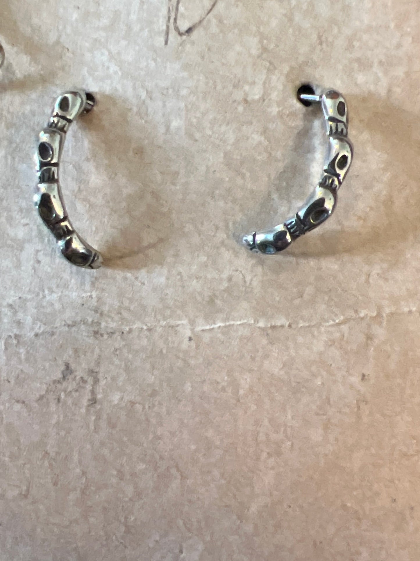 Multiple skull post earrings
