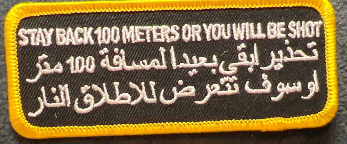 P#5040- stay back 100 m or you will be shot also in Arabic
