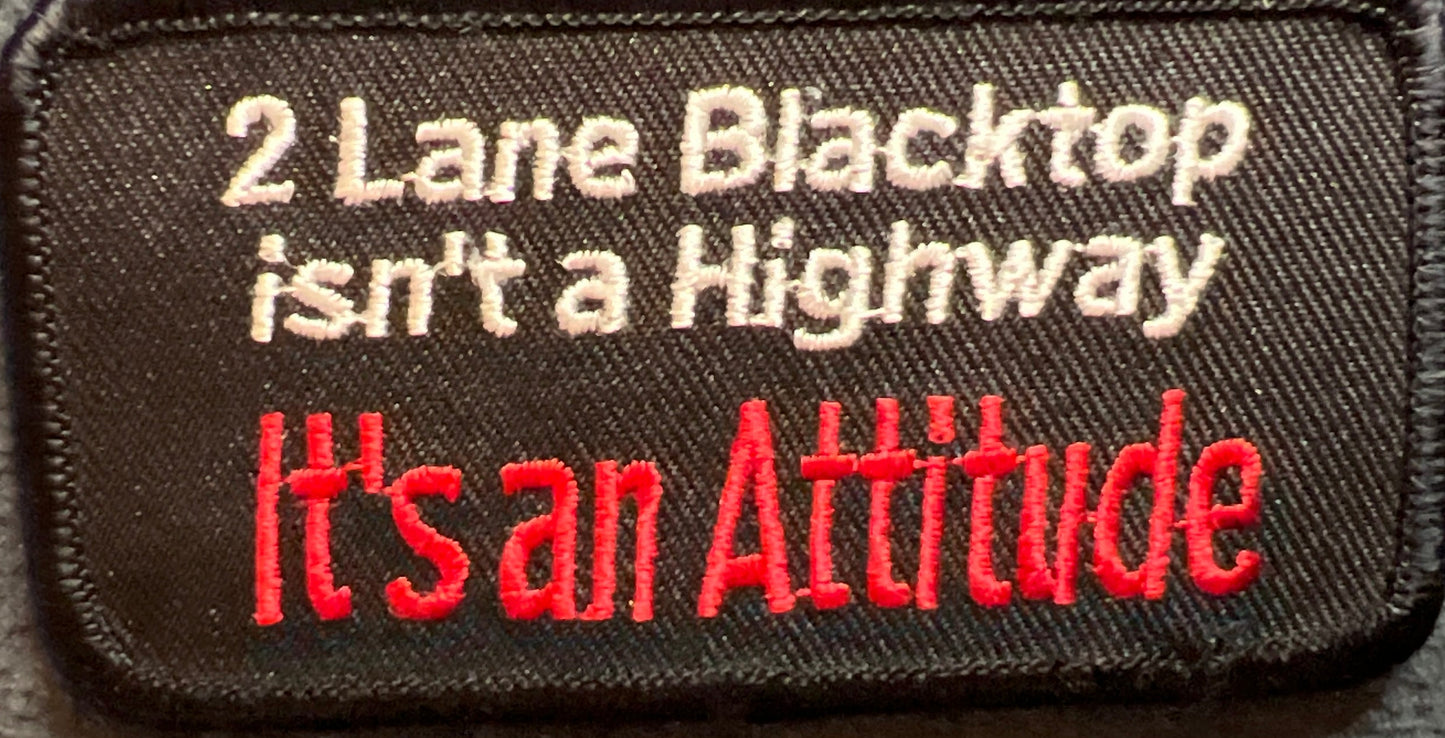 P#5049- two lane black top isn't a highway. It's an attitude.